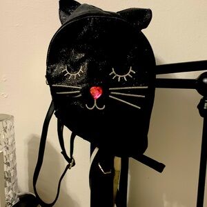 A black cat backpack